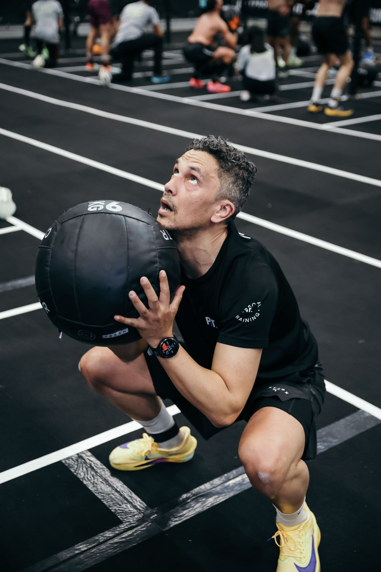 Jeffrey tijdens wall balls in de training